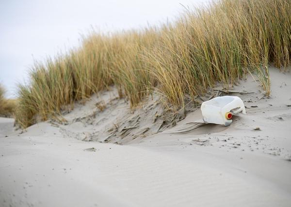The Plastic Waste Game: When Asymmetric Information Rewards the Rich and Penalizes the Poor